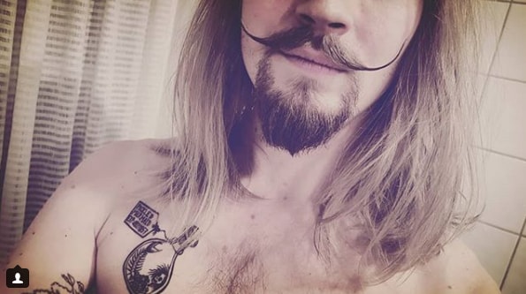 Elongated Blonde Handlebar Mustache Men Style with Long Hairs